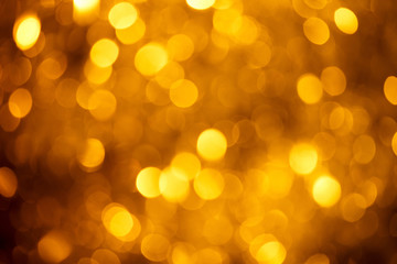 Fototapeta premium Blurred golden light sparks bokeh background
