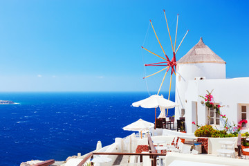 Famous windmills in Oia town on Santorini island, Greece