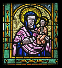 Fototapeta premium Mary with baby Jesus, Stained glass in Votiv Kirche in Vienna