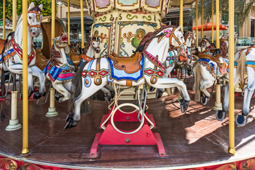 Fototapeta na wymiar Carousel horses on a Merry-go-round