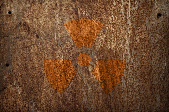 nuclear radiation sign on rusty metal texture