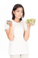 Pretty girl eating fresh vegetable salad