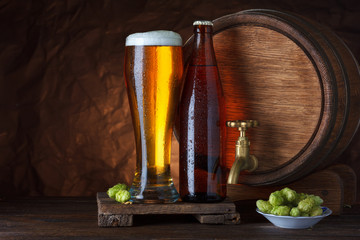 Bottled and unbottled beer glass with barrel