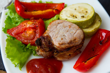 roasted pork steak with grilled vegetables