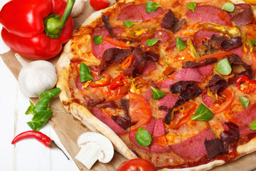 Pizza with ingredients closeup