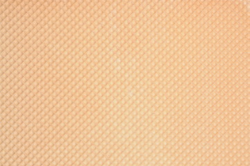 Golden waffle background with regular pattern