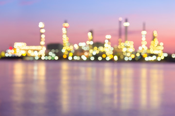 Abstract blur bokeh of oil gas refinery plant. May called petroleum, production or petrochemical plant. Industrial factory and engineering technology at night for business of power energy background.