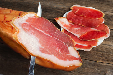 Parma ham (jamon) sliced on wooden board