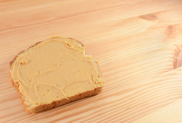 Peanut butter on a slice of bread