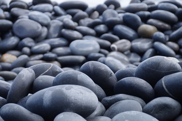 The hard pebbles closeup on the beach