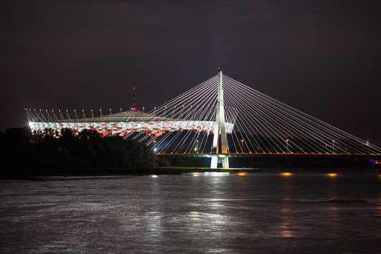 Fototapeta Night view of bridge and stadium in Warsaw