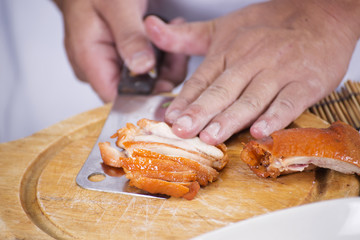 Chef choping roast chicken for cooking Noodle