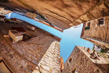 Fish-eye view of the old city on sky background