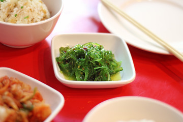close up japanese salad from seaweed and sesame in ceramic cup