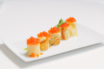 Crepes with salmon caviar and cheese