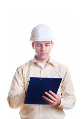 Engineer in helmet writing something