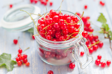 fresh red currant fruit jar wooden table