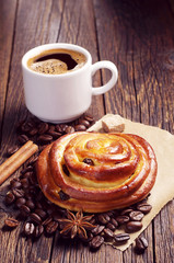 Bun with raisins and coffee