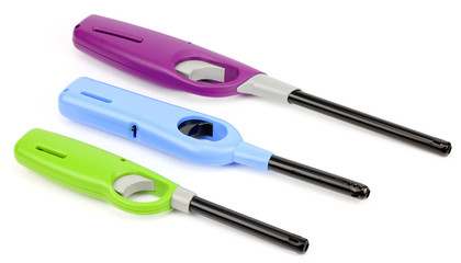 Three candle lighters over white