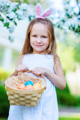 Little girl playing with Easter eggs