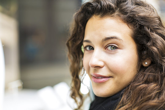 Attractive Woman Looking To Camera With A Subtle Smile