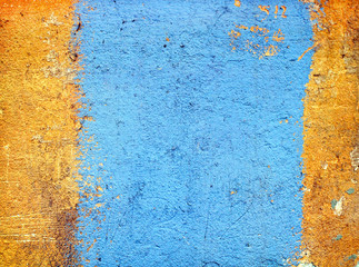 Texture of yellow plaster with a blue stripe.