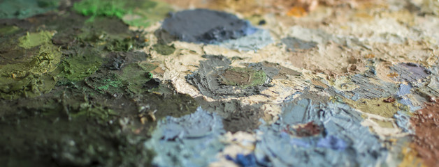 Cropped detail of dry oil paint on a palette