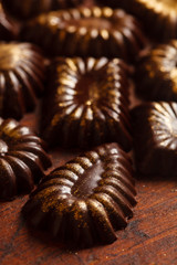 chocolate sweets with edible golden powdeer