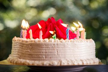 white creamy delicious cake with candles