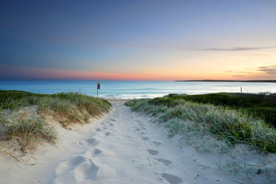 Sandy beach trail at dusk sundown Australia