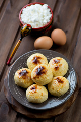Cottage cheese pancakes and various ingredients, studio shot