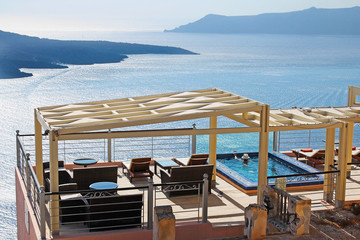 view of the volcano from the swimming pool in Santorini