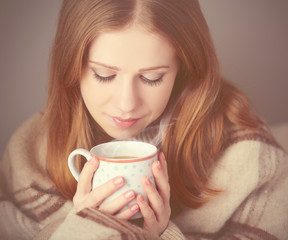 happy girland  cup of coffee on winter morning at home