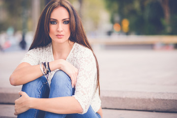 Young woman, wearing casual clothes, with long hair