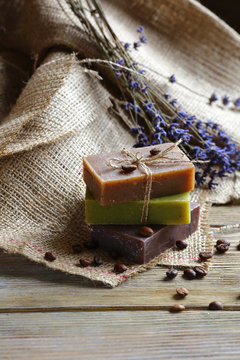 Handmade soap on wooden boards with coffee beans