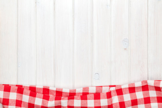 Red towel over wooden kitchen table