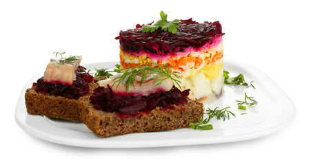 Russian herring salad  and sandwiches on plate isolated on