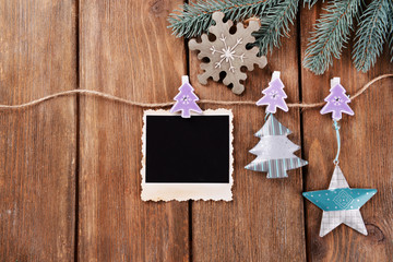 Blank photo frames and Christmas decor with snow fir tree