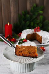Slice of cake covered cream with Christmas decoration