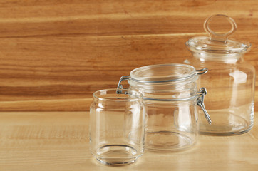 Set of empty glassware on wooden background
