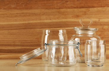 Set of empty glassware on wooden background