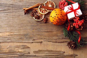 Orange with present box, spices, slices of dried lemon and