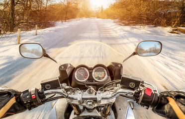 Biker First-person view. Winter slippery road