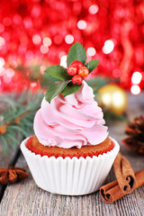 Cup-cake with cream and Christmas decoration