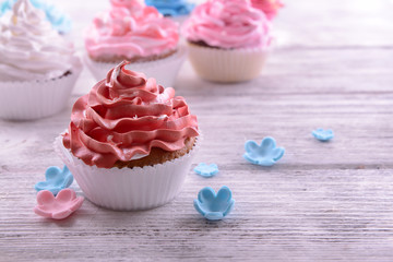 Delicious cupcakes on table close-up