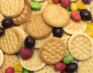 Biscuits with round colored candies. Photo. Background.