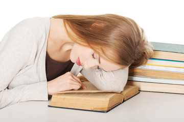 Tired woman preparing to exam