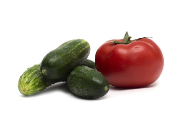 Red tomato and green cucumber. Photo.