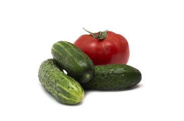 Red tomato and green cucumber. Photo.