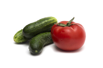Red tomato and green cucumber. Photo.